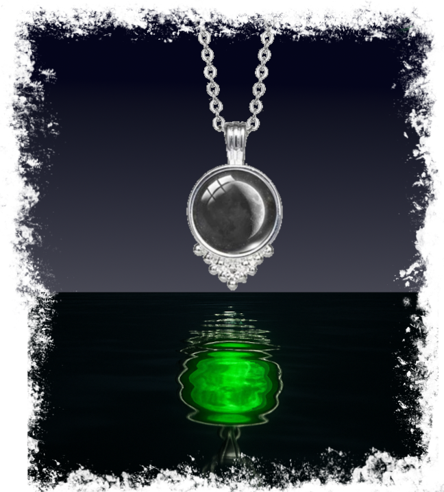 Necklace with a pendant reflecting green light on water
